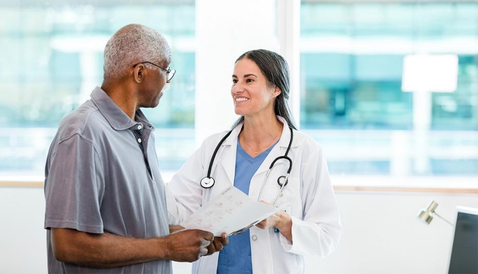 Eliminating Access to No-Cost Preventive Health Services Could Affect More Than 12 Million Adults Ages 50 to 64 The mid adult female doctor and her senior adult male patient discuss the home healthcare options listed in the brochure.